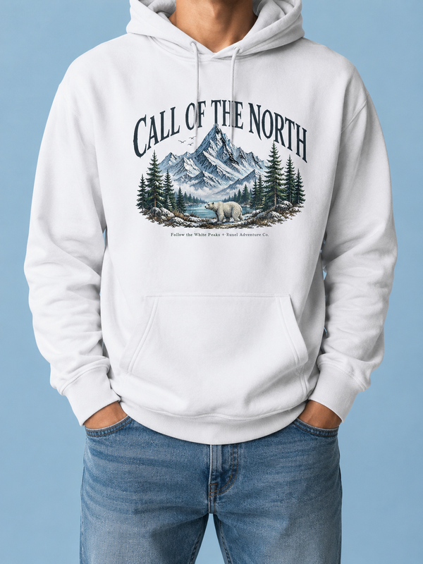 Ruxel Call of the North hoodie in Arctic White - illustrated snowy mountain, pine forest, lake and polar bear graphic beneath an arched title