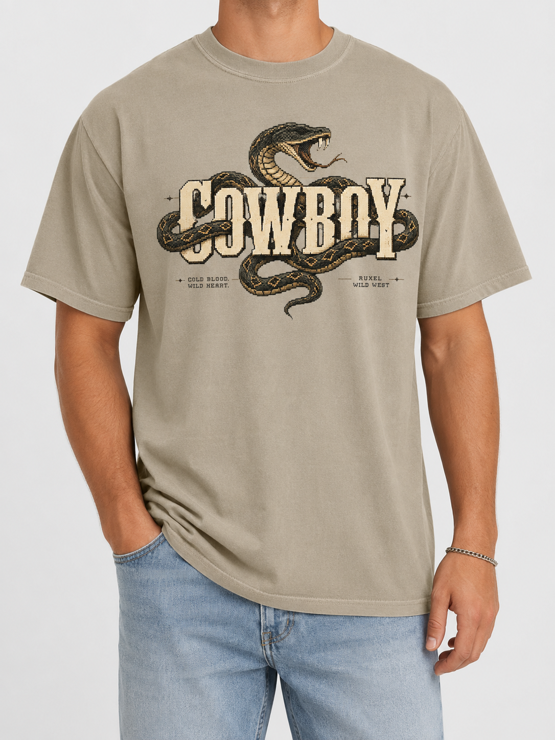 Ruxel Cowboy tee in Desert Sand - western snake coiled through bold COWBOY lettering with “Cold Blood Wild Heart” text