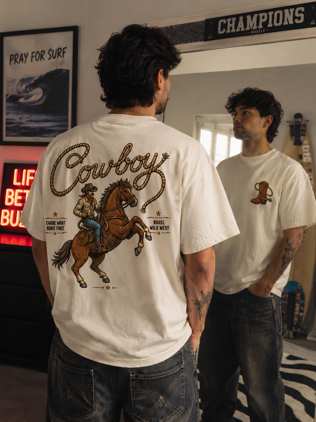 Man wearing the Ruxel Chase What Runs Free Bone western pixel tee, back view