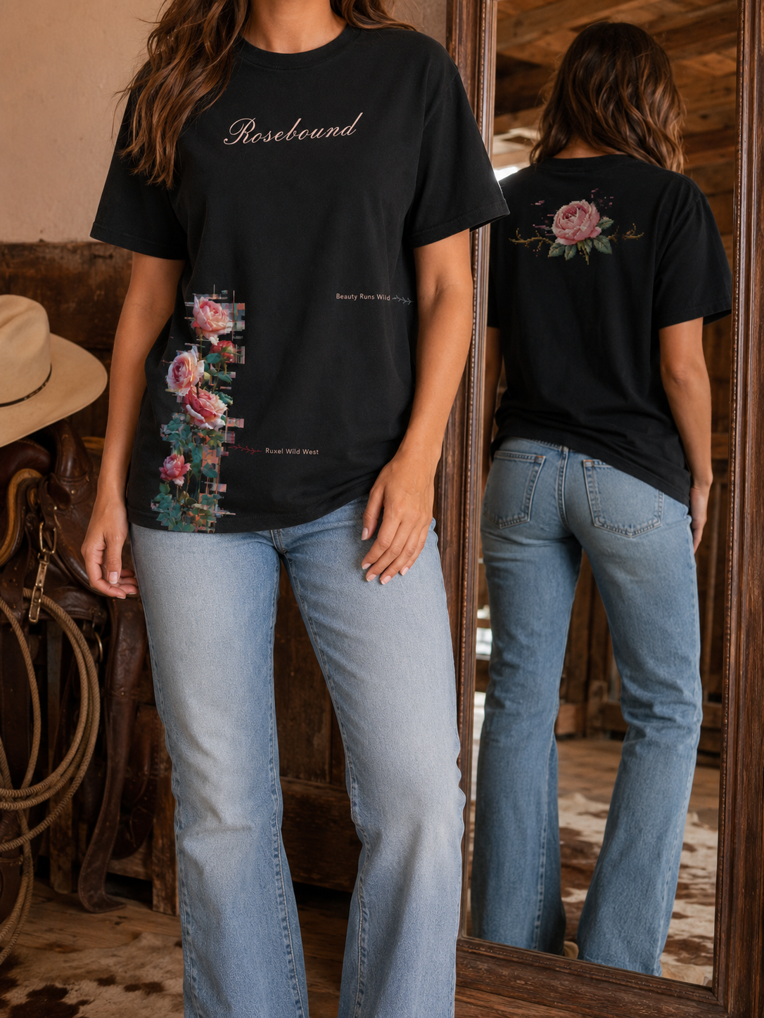 Woman in a western setting wearing the Ruxel Rosebound tee in Void Black - Rosebound script with a glitching rose vine down the left and Beauty Runs Wild text, back rose shown in the mirror