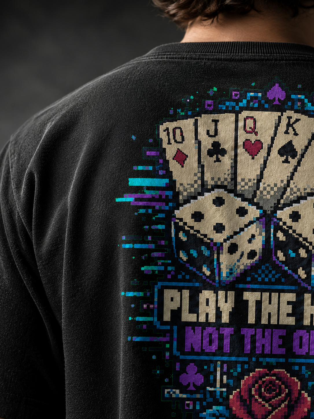 Close-up of the Ruxel Luck.exe back print on garment-dyed cotton - pixel-art royal flush, dice, rose and Play the Hand Not the Odds with glitch streaks
