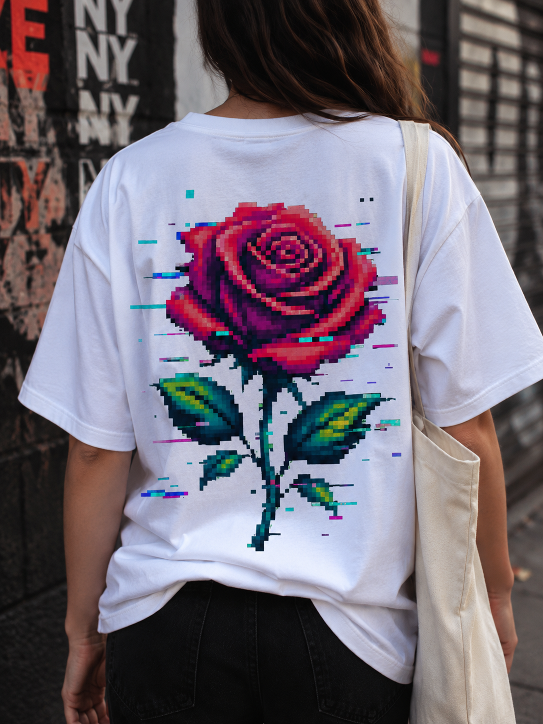 Woman wearing the Ruxel Glitch Rose Vintage White tee, back view showing the large pixel rose print