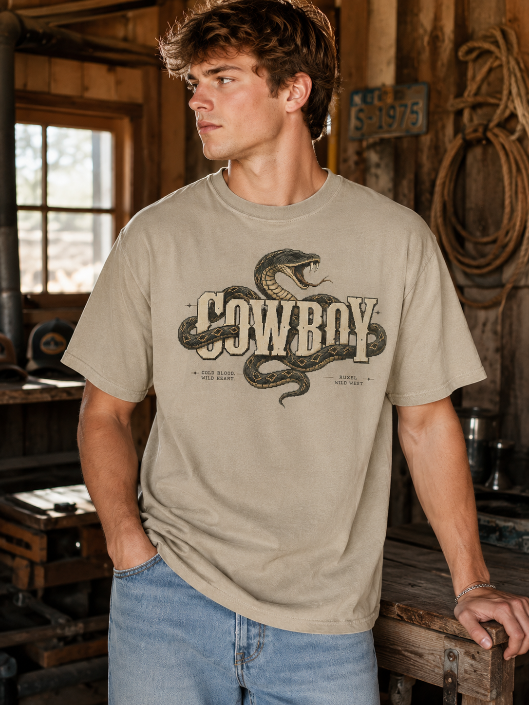 Man wearing the Ruxel Cowboy Desert Sand western snake graphic tee, front view