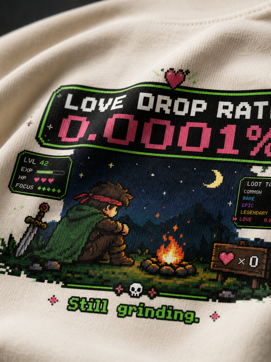 Close-up of the Love Drop Rate loot-screen print on Ruxel Cream garment-dyed cotton - campfire hero, stats panel and loot table