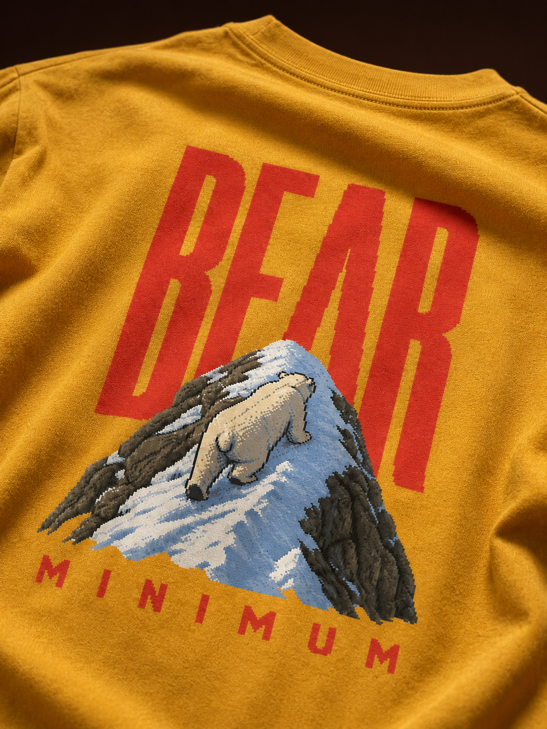 Close-up of Bear Minimum polar bear and mountain back print on heavyweight garment-dyed cotton