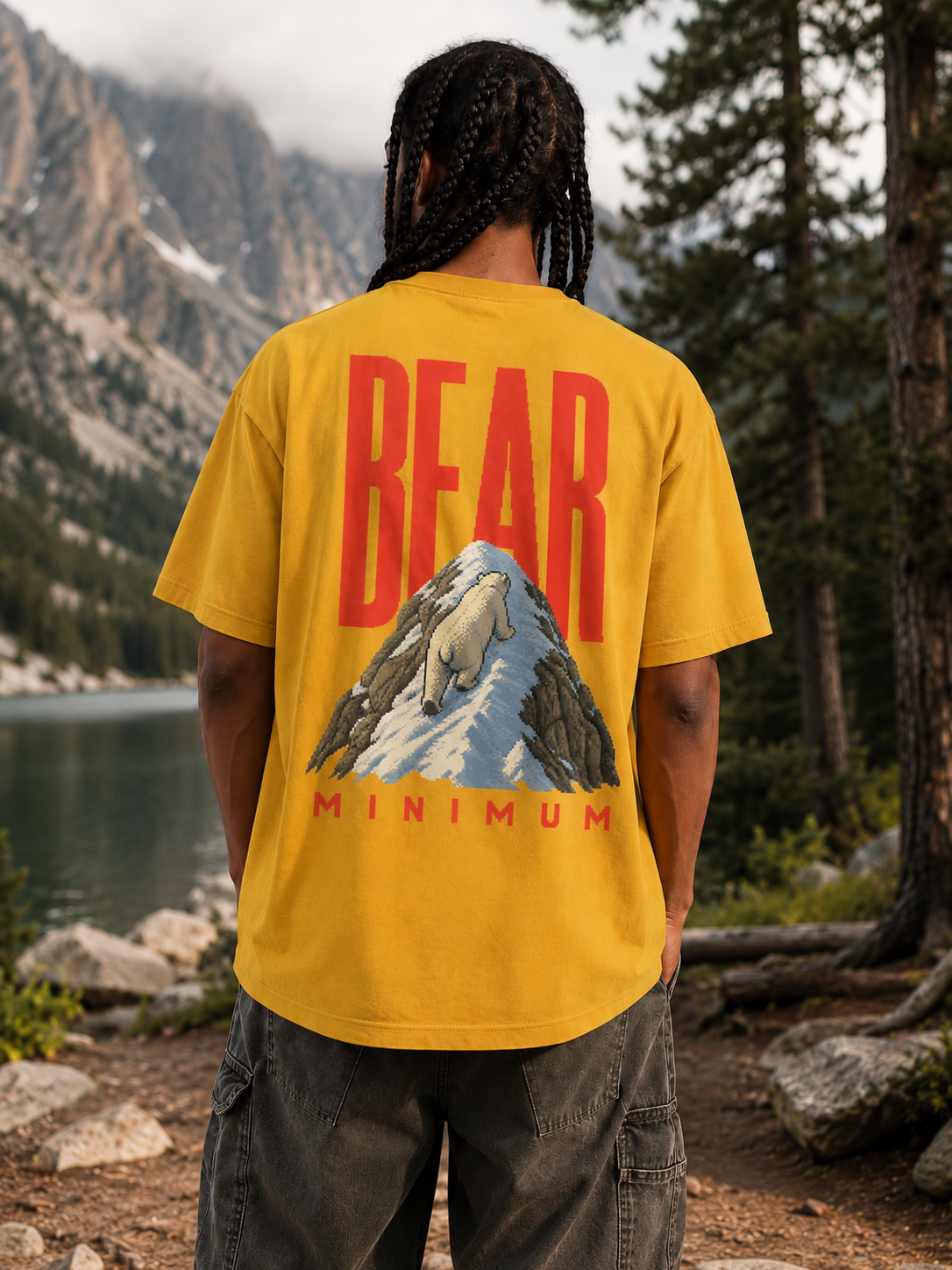 Bear Minimum polar bear graphic tee worn outdoors beside a mountain lake