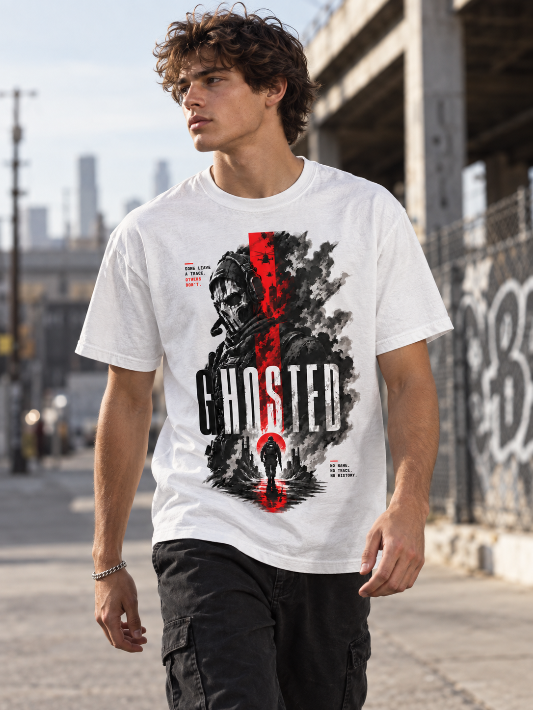 Male model wearing the white Ghosted tactical soldier graphic tee in an urban setting