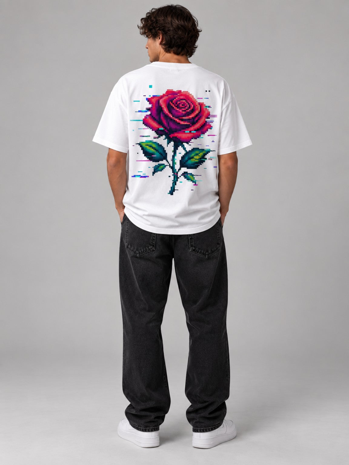 Man wearing the Ruxel Glitch Rose heavyweight tee in Vintage White, studio back view with large pixel rose graphic