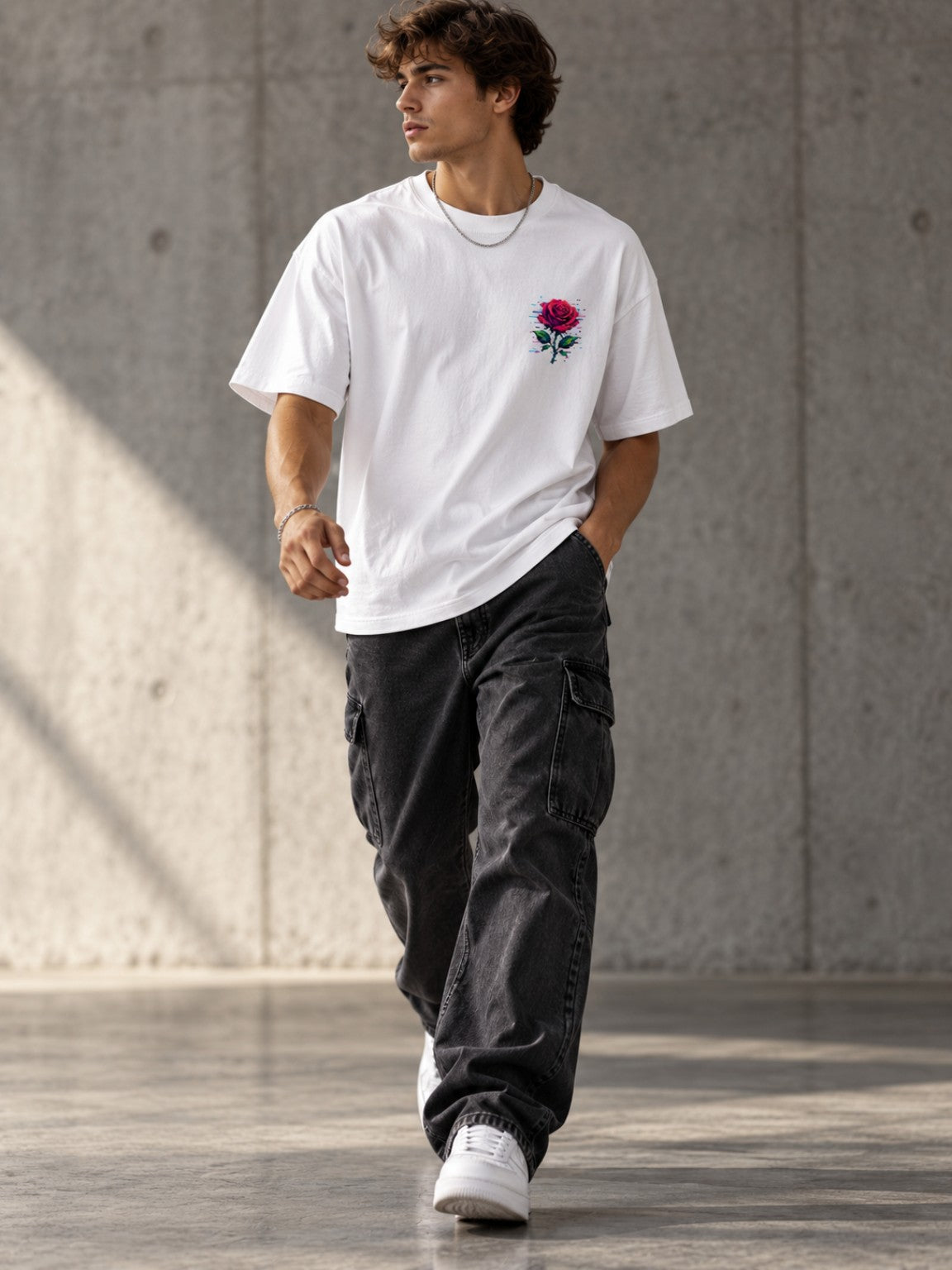 Man walking in the Ruxel Glitch Rose heavyweight tee in Vintage White, front lifestyle view with small pixel rose chest print