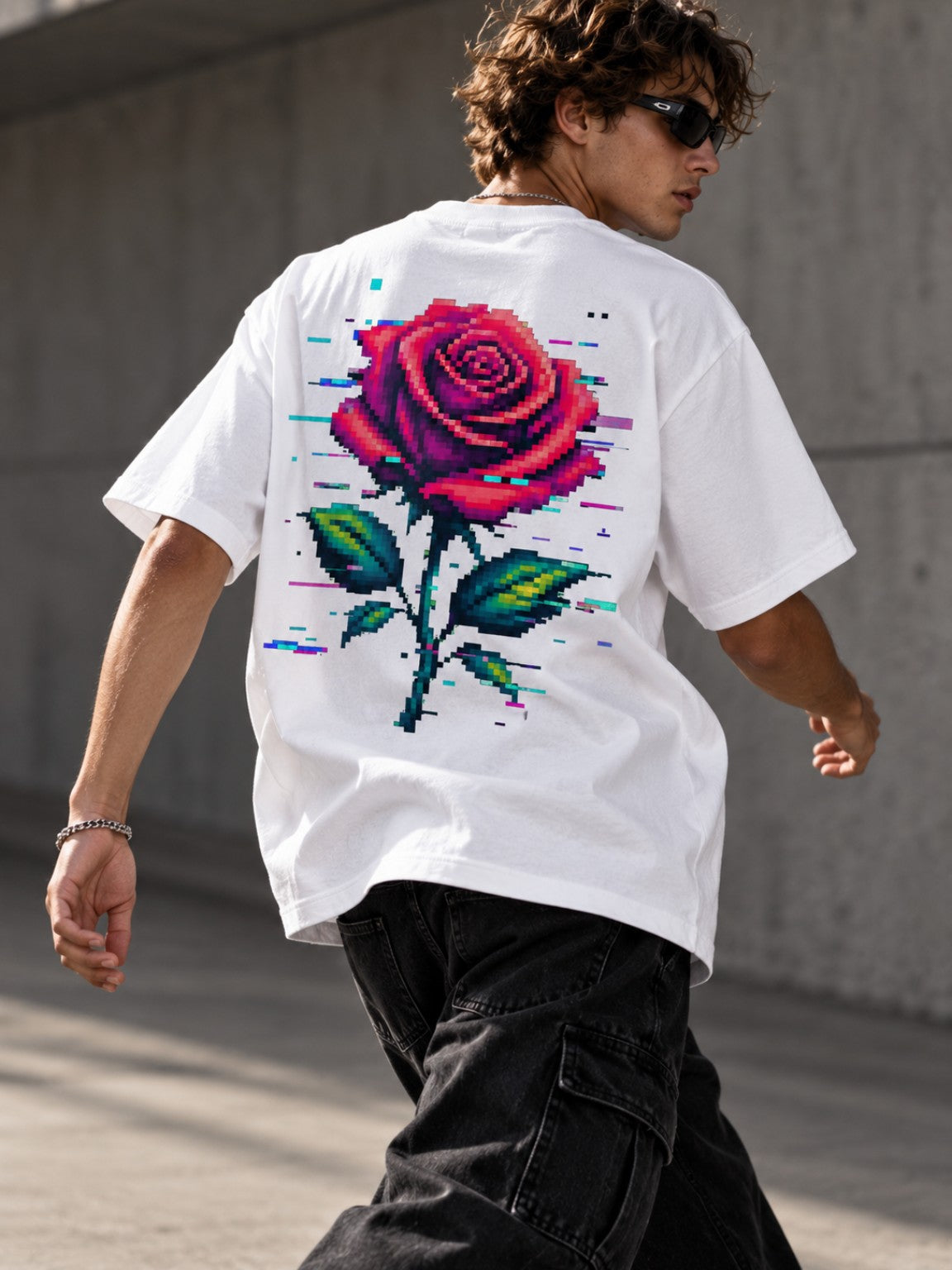 Man walking in the Ruxel Glitch Rose heavyweight tee in Vintage White, back lifestyle view with oversized red pixel rose artwork