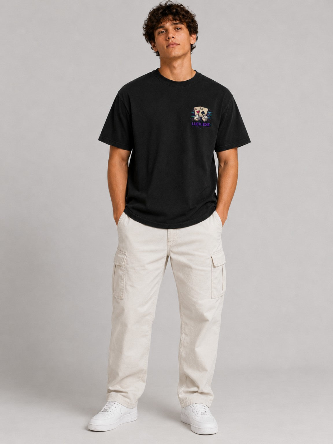 Full-body front fit of the Ruxel Luck.exe Vintage Black pixel-art tee showing its relaxed boxy silhouette and small chest graphic