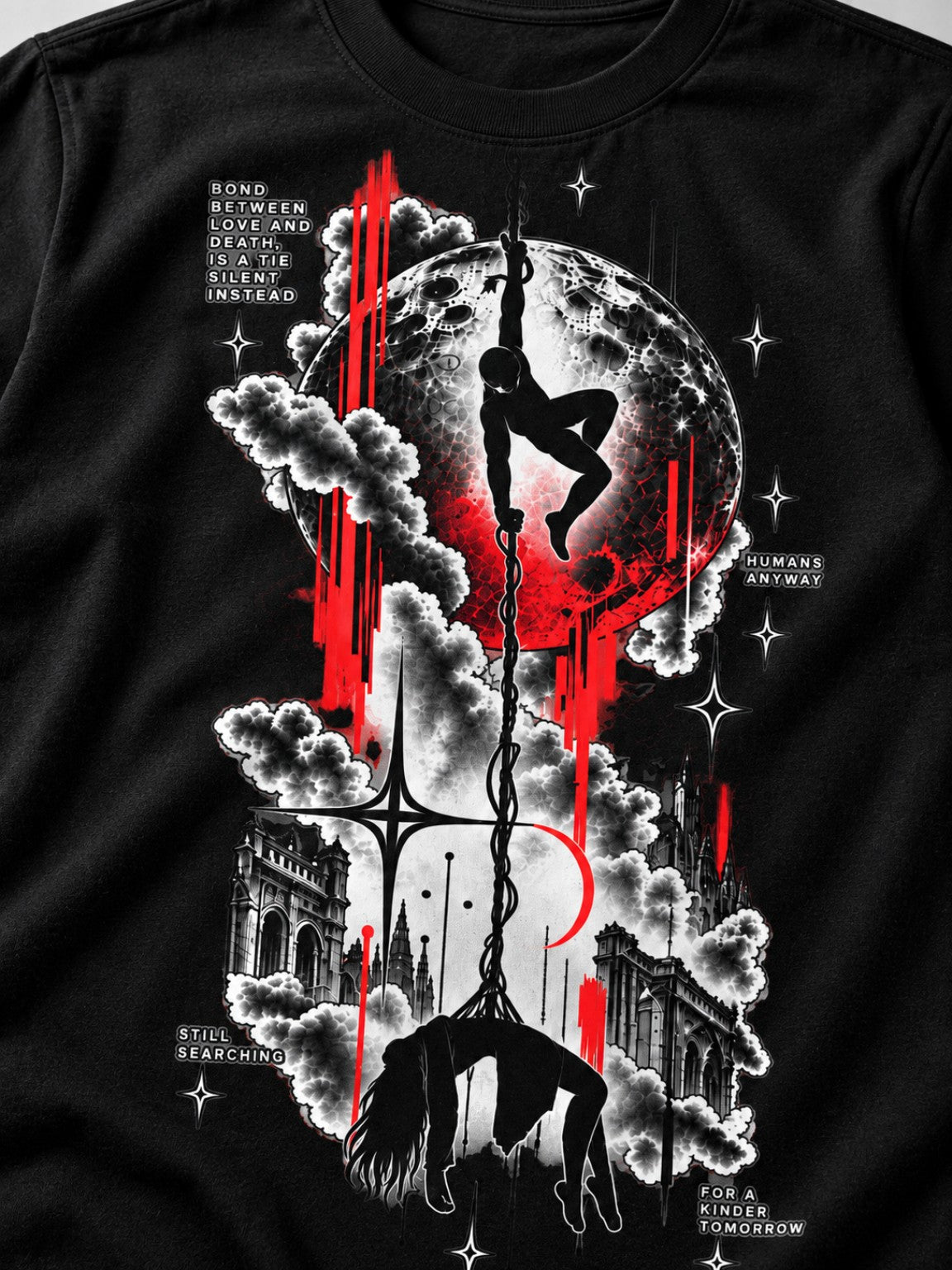 Close-up of the Tethered Souls crimson moon and gothic city front graphic on a black heavyweight tee